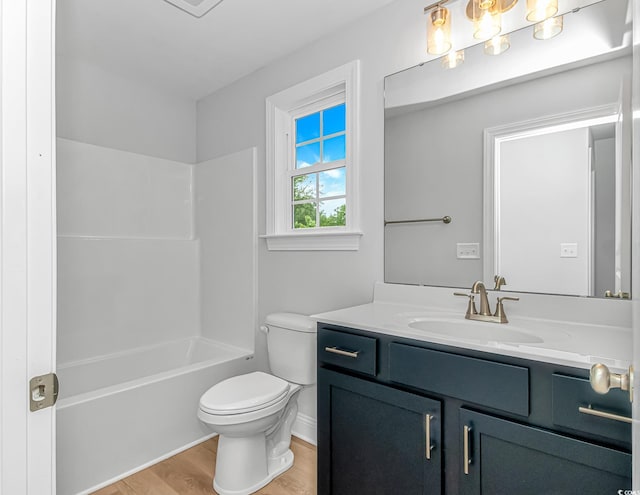 19 Coventry Pl, Pawleys Island, SC 29585 - bathroom featuring vanity, wood finished floors, toilet,  shower combination, and baseboards