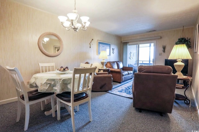 carpeted dining space featuring an inviting chandelier
