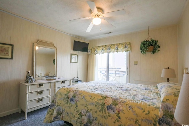 bedroom featuring dark carpet, a ceiling fan, crown molding, and visible vents