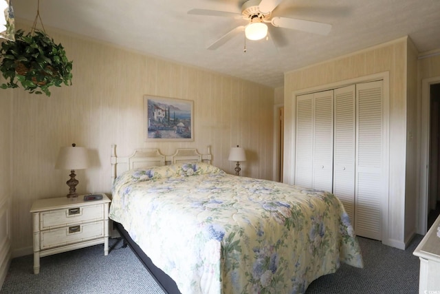 carpeted bedroom with a closet and a ceiling fan