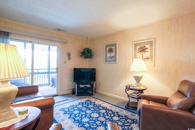 living area with carpet floors, baseboards, and visible vents