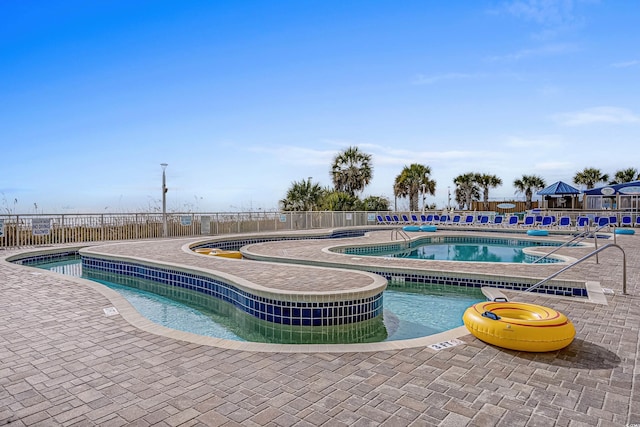 2801 S Ocean Blvd # 231, North Myrtle Beach, SC 29582 - community pool with a hot tub, a patio area, and fence