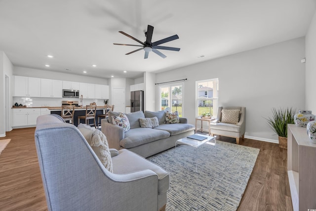 204 Leaflet Loop, Pawleys Island, SC 29585 - living area with wood finished floors, recessed lighting, a ceiling fan, and baseboards