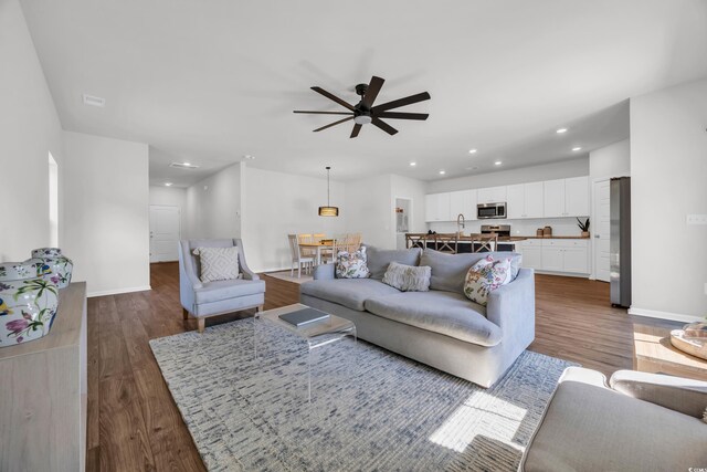 204 Leaflet Loop, Pawleys Island, SC 29585 - living area with wood finished floors, ceiling fan, recessed lighting, and baseboards