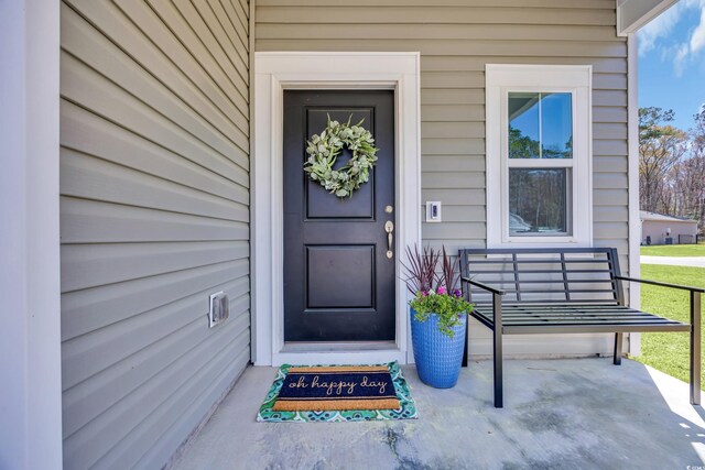 204 Leaflet Loop, Pawleys Island, SC 29585 - view of exterior entry featuring a porch