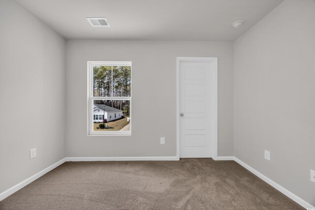 204 Leaflet Loop, Pawleys Island, SC 29585 - spare room with carpet, a smoke detector, and baseboards