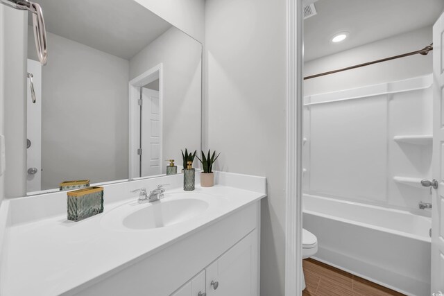 204 Leaflet Loop, Pawleys Island, SC 29585 - bathroom with vanity, toilet, shower / bath combination, and wood finished floors