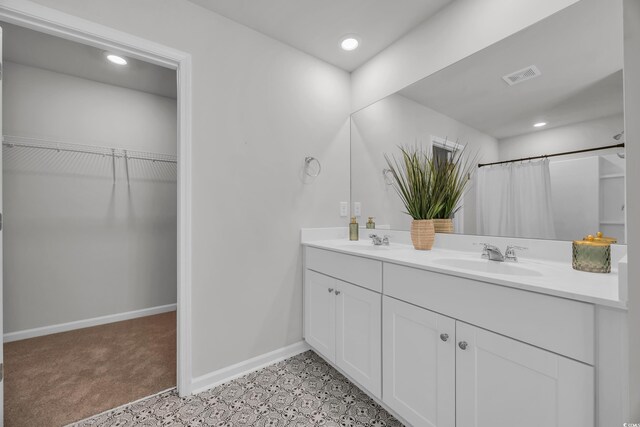 204 Leaflet Loop, Pawleys Island, SC 29585 - full bath featuring double vanity, baseboards, recessed lighting, a spacious closet, and a shower with curtain