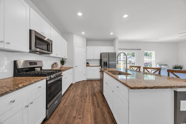 204 Leaflet Loop, Pawleys Island, SC 29585 - kitchen with appliances with stainless steel finishes, a sink, dark wood-style flooring, backsplash, and recessed lighting