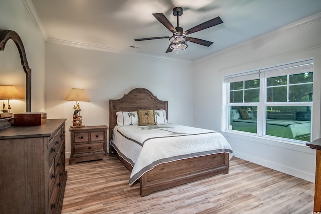 224 Oak Bay Dr, Georgetown, SC 29440 - bedroom featuring ornamental molding, light wood-style floors, baseboards, and ceiling fan