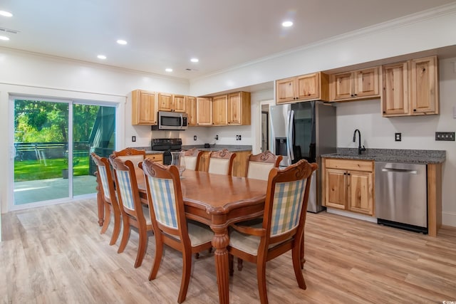 224 Oak Bay Dr, Georgetown, SC 29440 - dining space featuring crown molding, light wood-style flooring, and recessed lighting