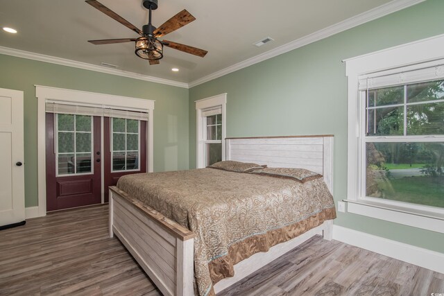 224 Oak Bay Dr, Georgetown, SC 29440 - bedroom featuring ornamental molding, wood finished floors, recessed lighting, baseboards, and french doors