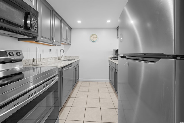 601 Mitchell Dr Unit 801, Myrtle Beach, SC 29577 - kitchen with light stone countertops, baseboards, recessed lighting, a sink, and stainless steel appliances