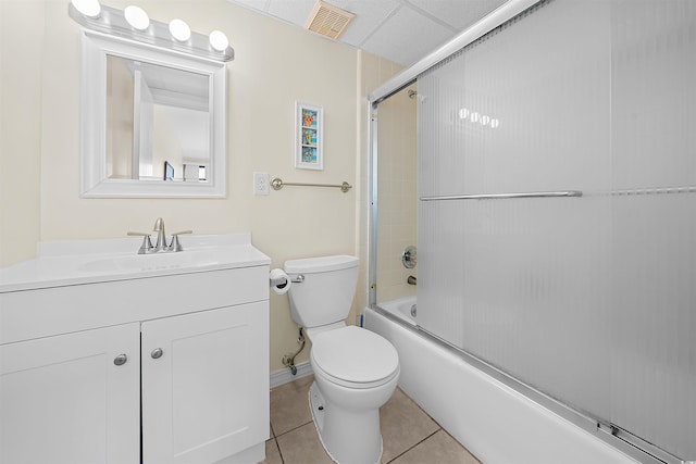 601 Mitchell Dr Unit 801, Myrtle Beach, SC 29577 - full bath with tile patterned flooring, vanity, toilet, baseboards, and bath / shower combo with glass door