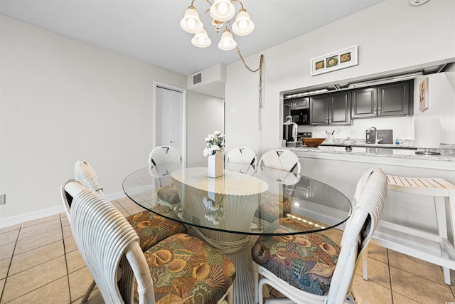 601 Mitchell Dr Unit 801, Myrtle Beach, SC 29577 - dining space featuring visible vents, baseboards, light tile patterned floors, and a chandelier