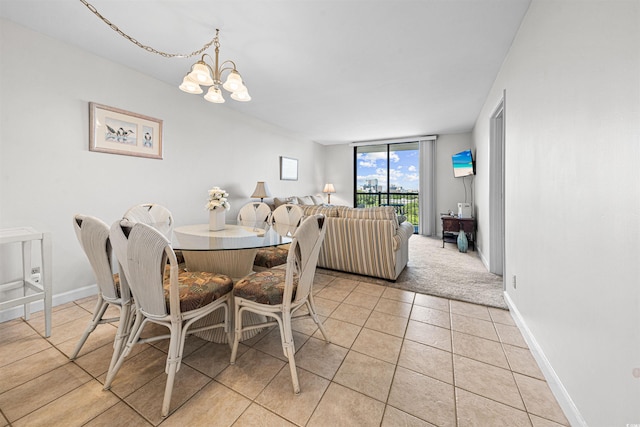 601 Mitchell Dr Unit 801, Myrtle Beach, SC 29577 - dining area featuring light tile patterned flooring, baseboards, and an inviting chandelier
