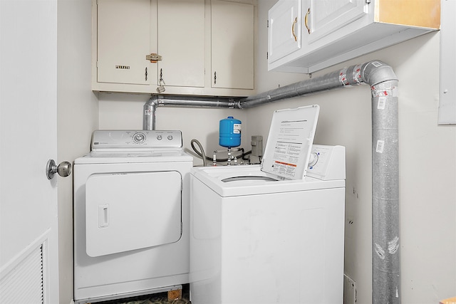 601 Mitchell Dr Unit 801, Myrtle Beach, SC 29577 - washroom with visible vents, washer and clothes dryer, and cabinet space