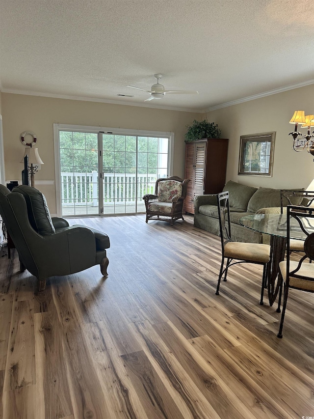4639 Wild Iris Dr Unit 43-204, Myrtle Beach, SC 29577 - living room featuring crown molding, a textured ceiling, wood finished floors, and ceiling fan