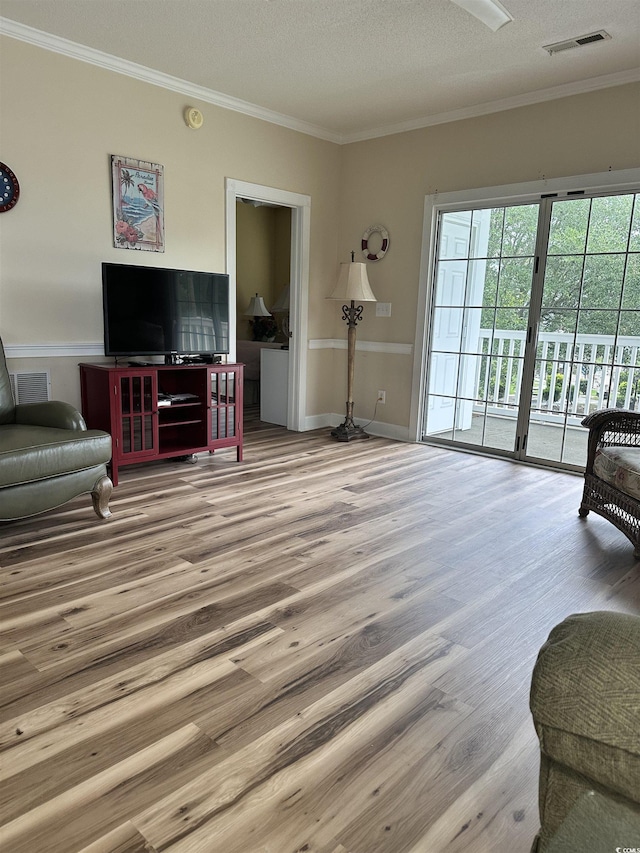 4639 Wild Iris Dr Unit 43-204, Myrtle Beach, SC 29577 - living room with wood finished floors, ornamental molding, wainscoting, and a textured ceiling