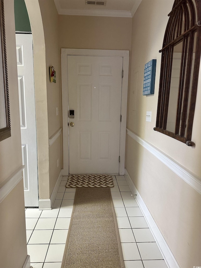 4639 Wild Iris Dr Unit 43-204, Myrtle Beach, SC 29577 - doorway featuring arched walkways, ornamental molding, light tile patterned floors, and baseboards