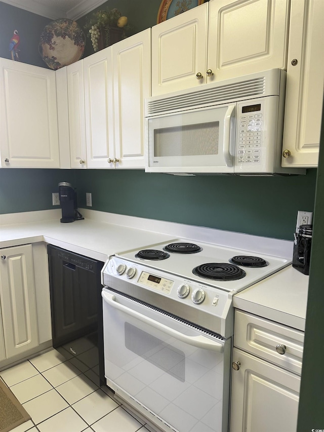 4639 Wild Iris Dr Unit 43-204, Myrtle Beach, SC 29577 - kitchen featuring white appliances, light countertops, light tile patterned floors, and white cabinets