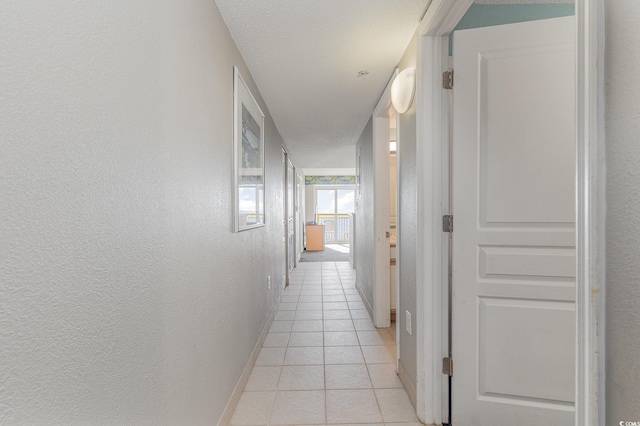 2801 S Ocean Blvd Unit 1509, North Myrtle Beach, SC 29582 - hallway featuring light tile patterned flooring and baseboards