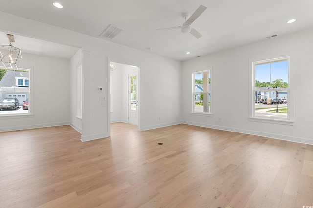 spare room with light wood finished floors, ceiling fan, baseboards, and recessed lighting