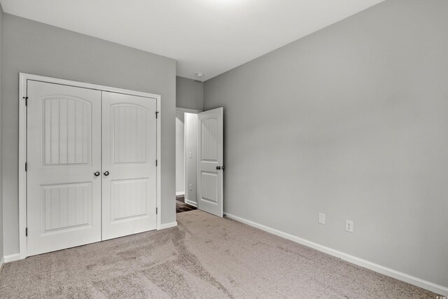 72 Millsite Ct, Georgetown, SC 29440 - unfurnished bedroom featuring carpet floors, a closet, and baseboards