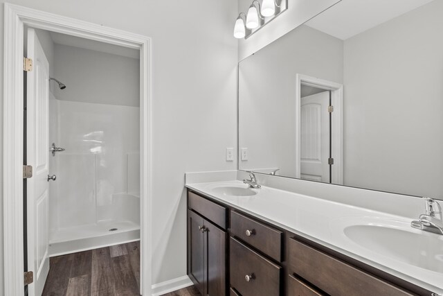 72 Millsite Ct, Georgetown, SC 29440 - full bath with wood finished floors, a shower, and double vanity