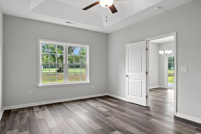 72 Millsite Ct, Georgetown, SC 29440 - spare room featuring a raised ceiling, plenty of natural light, a ceiling fan, and dark wood-type flooring
