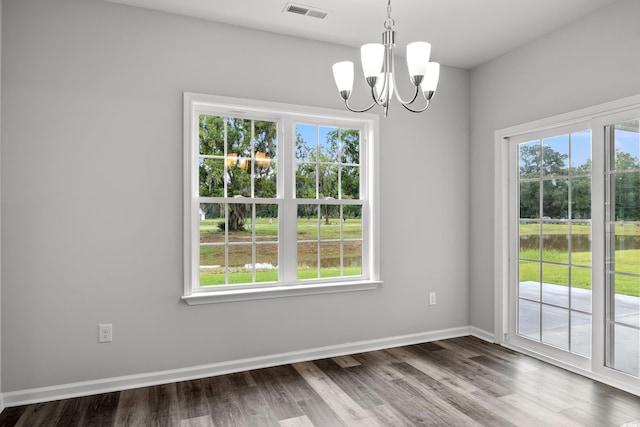 72 Millsite Ct, Georgetown, SC 29440 - unfurnished dining area with plenty of natural light, a chandelier, wood finished floors, and baseboards