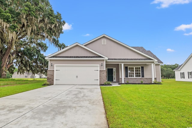 72 Millsite Ct, Georgetown, SC 29440 - craftsman-style home featuring brick siding, an attached garage, concrete driveway, and a front lawn