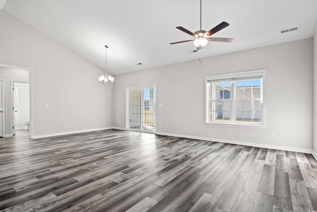 unfurnished living room featuring a chandelier, dark wood-style floors, a ceiling fan, high vaulted ceiling, and baseboards