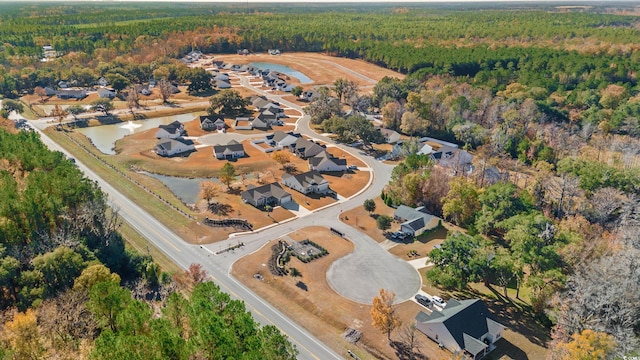 view of property location featuring a forest