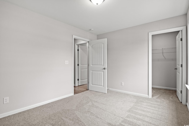 235 Six Mile Creek Dr, Georgetown, SC 29440 - unfurnished bedroom with baseboards, carpet flooring, a closet, and a spacious closet