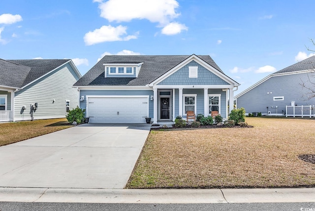 5606 Whitebark Dr, Myrtle Beach, SC 29577 - view of front of property with an attached garage, driveway, a front lawn, and a porch