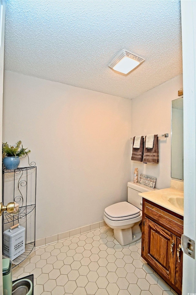 4242 Pinehurst Cir Unit N4, Little River, SC 29566 - bathroom featuring vanity and a textured ceiling