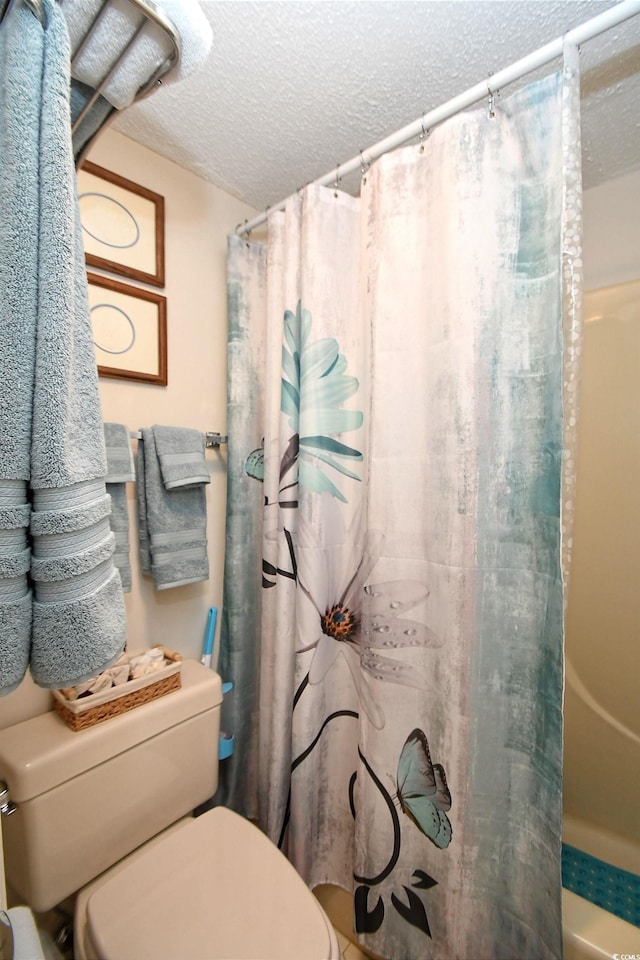 4242 Pinehurst Cir Unit N4, Little River, SC 29566 - full bathroom featuring toilet and a textured ceiling