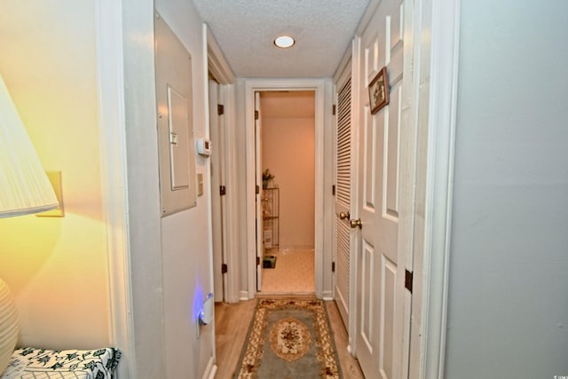 4242 Pinehurst Cir Unit N4, Little River, SC 29566 - hall featuring a textured ceiling