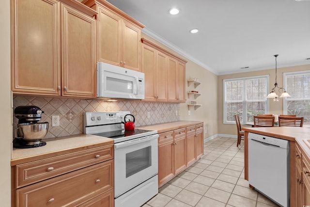 192 Berkshire Loop, Pawleys Island, SC 29585 - kitchen with white appliances, backsplash, crown molding, light countertops, and baseboards