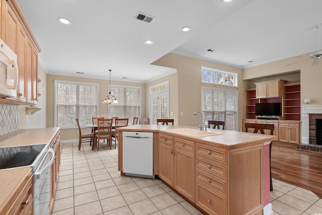 192 Berkshire Loop, Pawleys Island, SC 29585 - kitchen featuring white appliances, a sink, light tile patterned floors, ornamental molding, and light countertops
