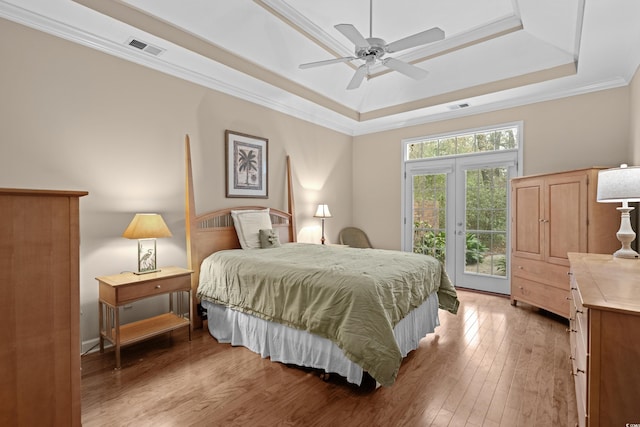 192 Berkshire Loop, Pawleys Island, SC 29585 - bedroom featuring a raised ceiling, access to outside, light wood finished floors, ornamental molding, and ceiling fan