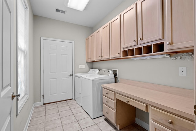 192 Berkshire Loop, Pawleys Island, SC 29585 - laundry area featuring cabinet space, washing machine and clothes dryer, plenty of natural light, and light tile patterned floors