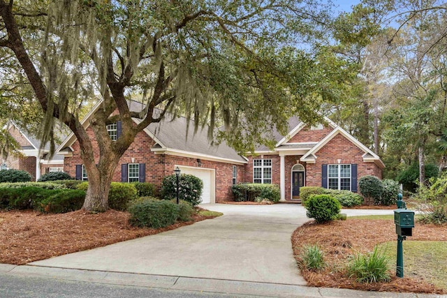 192 Berkshire Loop, Pawleys Island, SC 29585 - view of front of home with concrete driveway, brick siding, and a garage
