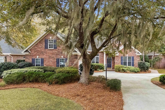 192 Berkshire Loop, Pawleys Island, SC 29585 - obstructed view of property featuring brick siding and concrete driveway