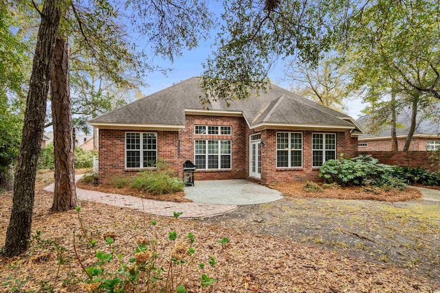 192 Berkshire Loop, Pawleys Island, SC 29585 - back of house with a patio, brick siding, and a shingled roof