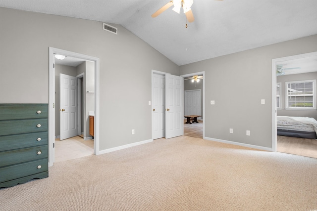 1202 Formby Ct, Myrtle Beach, SC 29588 - unfurnished bedroom featuring baseboards, visible vents, lofted ceiling, and light colored carpet