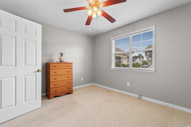 1202 Formby Ct, Myrtle Beach, SC 29588 - carpeted bedroom featuring baseboards, a ceiling fan, and a textured ceiling