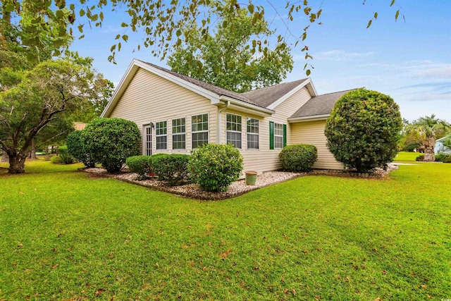 1202 Formby Ct, Myrtle Beach, SC 29588 - view of side of home featuring a shingled roof and a yard