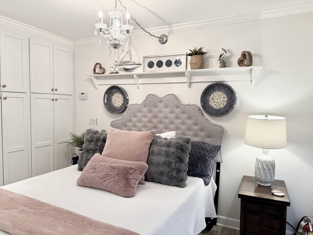 2001 S Ocean Blvd Unit 621, Myrtle Beach, SC 29577 - bedroom featuring ornamental molding and a chandelier